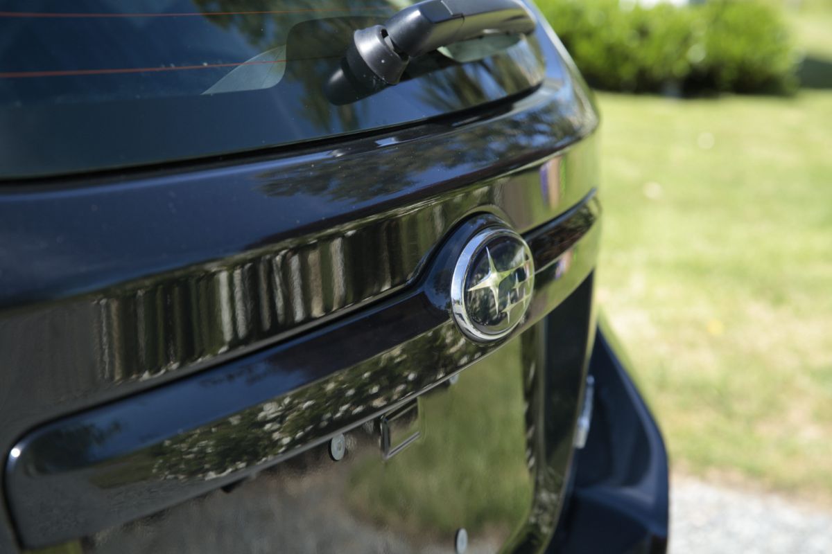 Glossy detailed rear of a dark vehicle